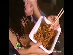 Naughty babe eating noodles seasoned with shit
